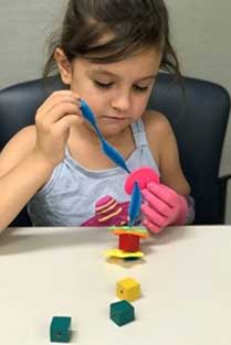 A girl practising mobility with her left hand