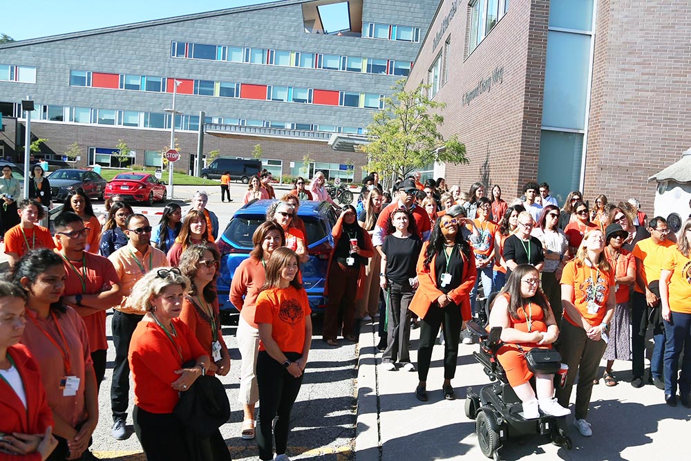 A group of people with their orange shirt