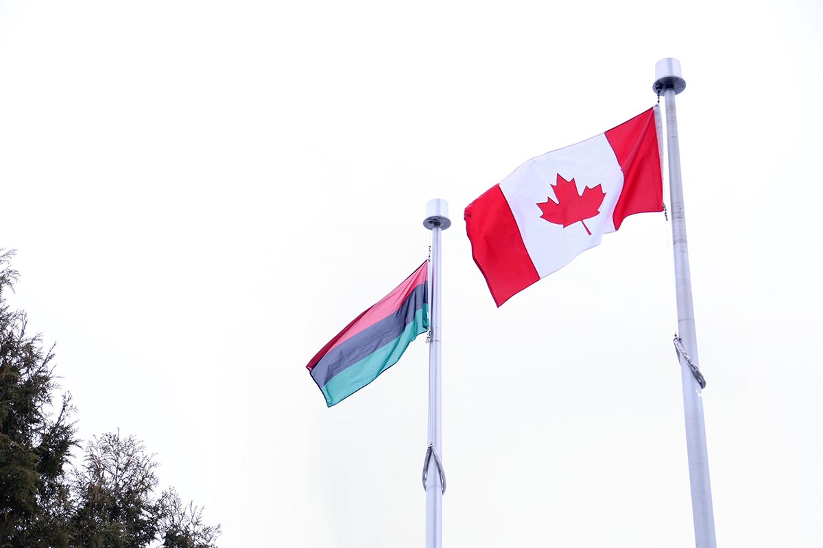 Canadian flag and anti-black racism flag