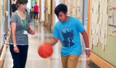 Boy practicing with a basketball
