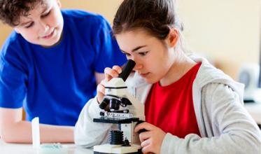 Girl looking in microscope
