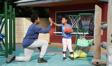 Client and family member giving a high-five