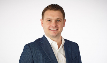 A man with light skin tone and short brown hair.