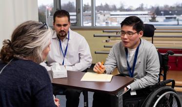 Three people in a meeting