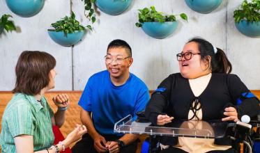 3 people sitting and chatting