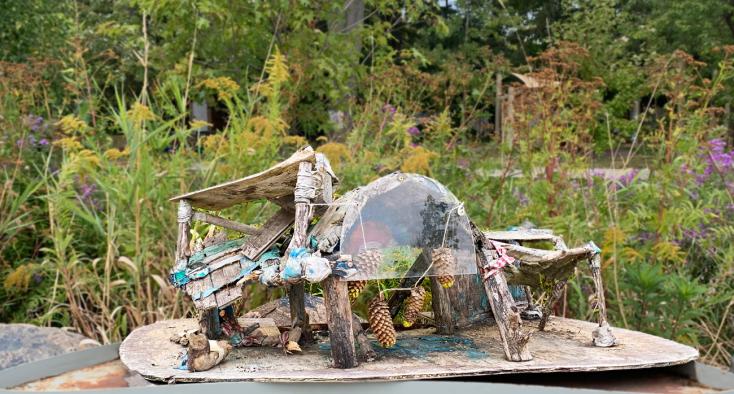 Modern art piece showing in a garden