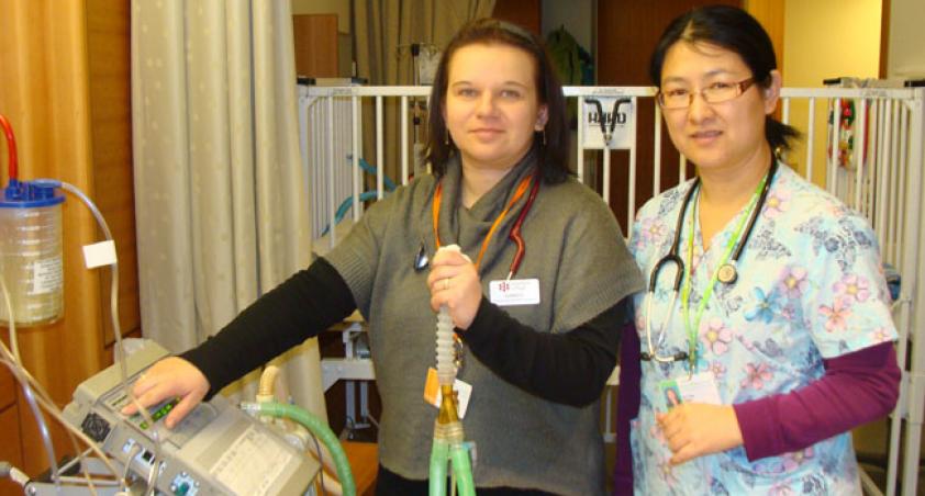 Nurse teaching student nurse on a breathing machine