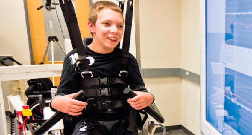 Boy in harness smiling