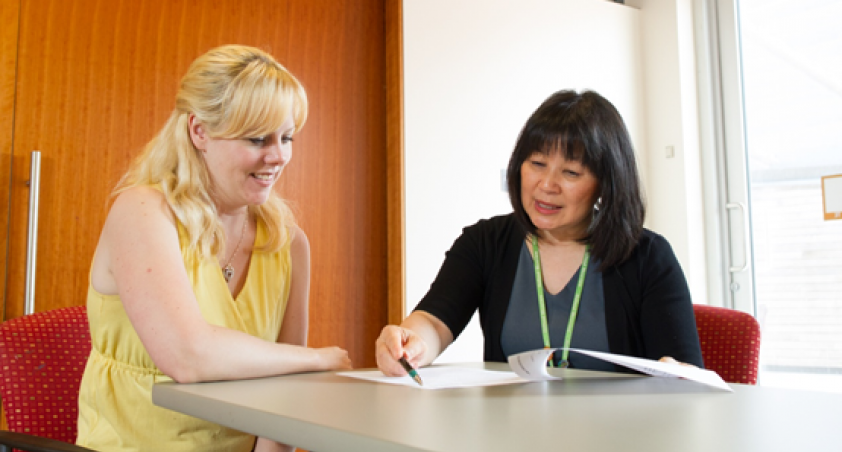 2 women looking at a questionnaire