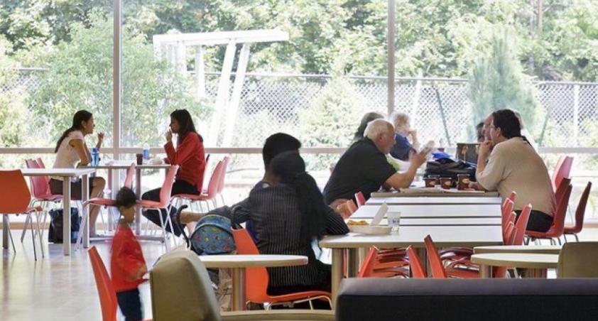 Clients and visitors eating in the cafeteria
