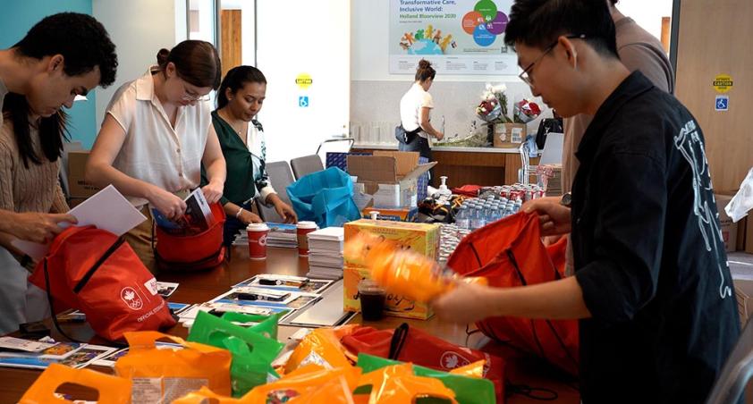 Some adults preparing some gifts for kids