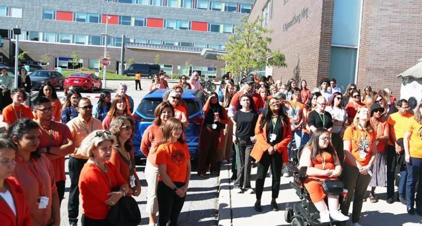 Group of people with their orange shirt
