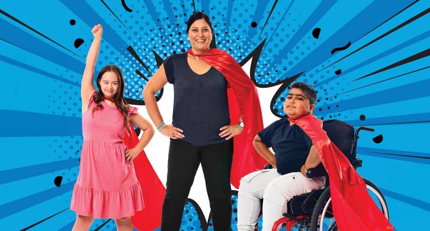 An adult with 2 children, all with their red cape on