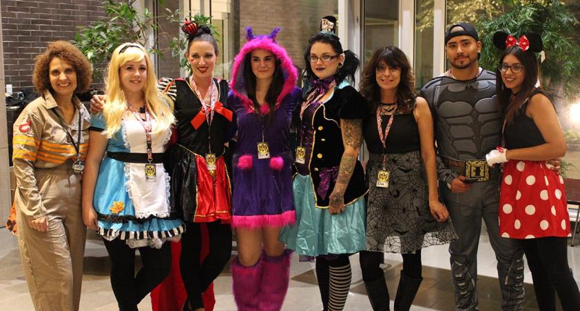 A group of people with their Halloween costume.