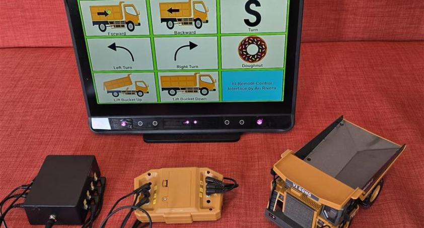 Image of complete set up including SGD system, switch interface, and adaptive toy