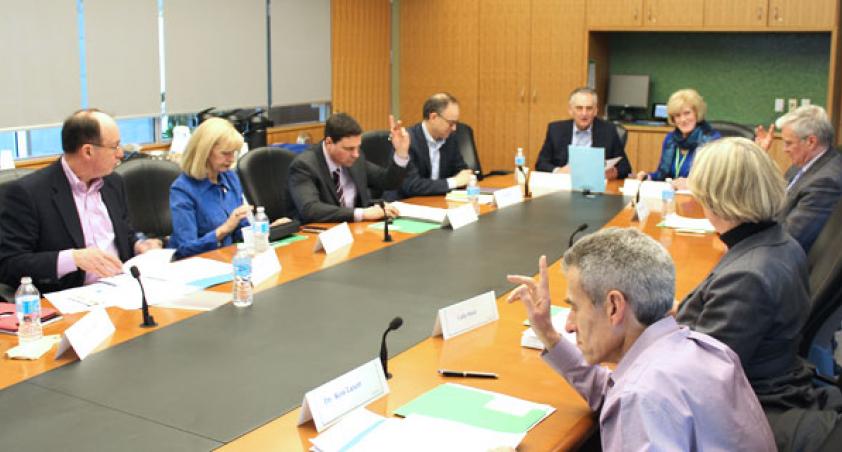 A meeting in the Board Room