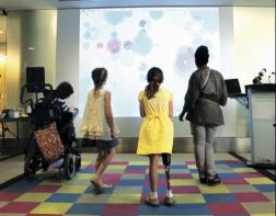 Kids enjoying the ScreenPlay interactive animations at Holland Bloorview.