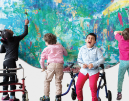 Children painting a large mural