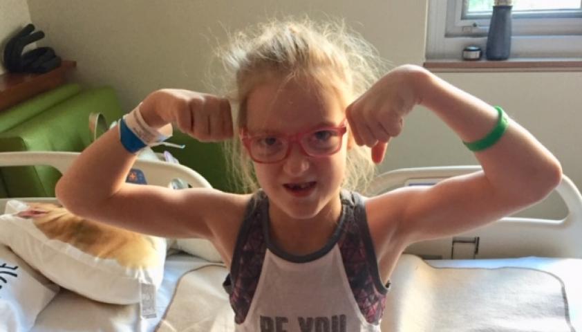 Olivia flexing her muscles.