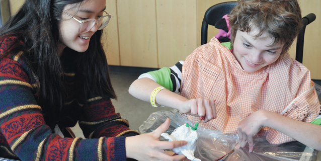 Student volunteer with client Student volunteer with client