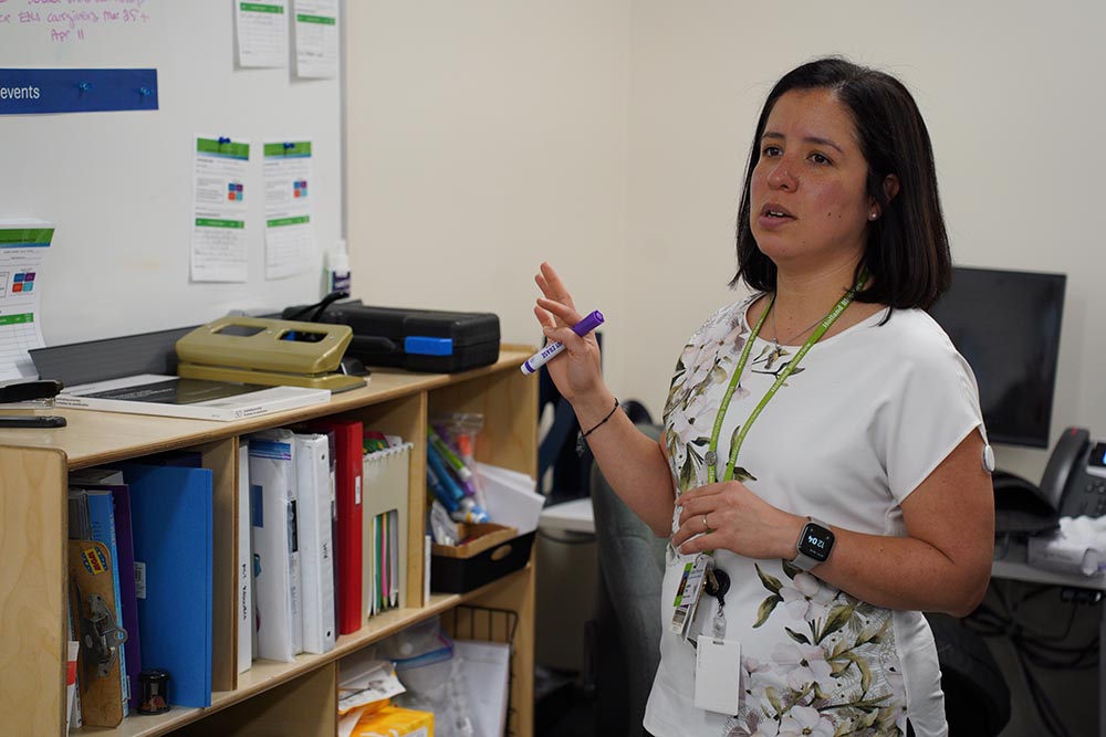 Leticia Toro is discussing with her colleague