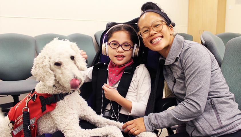 Andrea and Bella smiling to the camera.