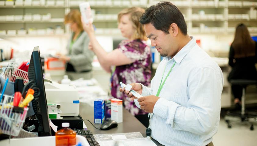 Pharmacists and technicians at work.