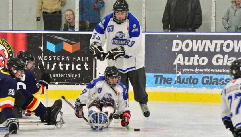 Angelo playing sledgehockey.