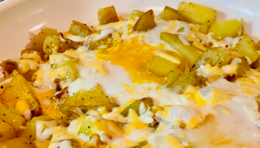 Cheese and eggs baked onto cubed, cooked potatos.