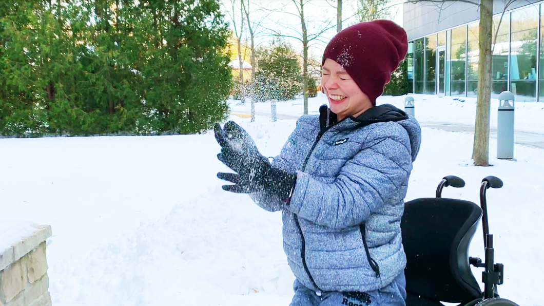 Aly throwing snow in the air. 