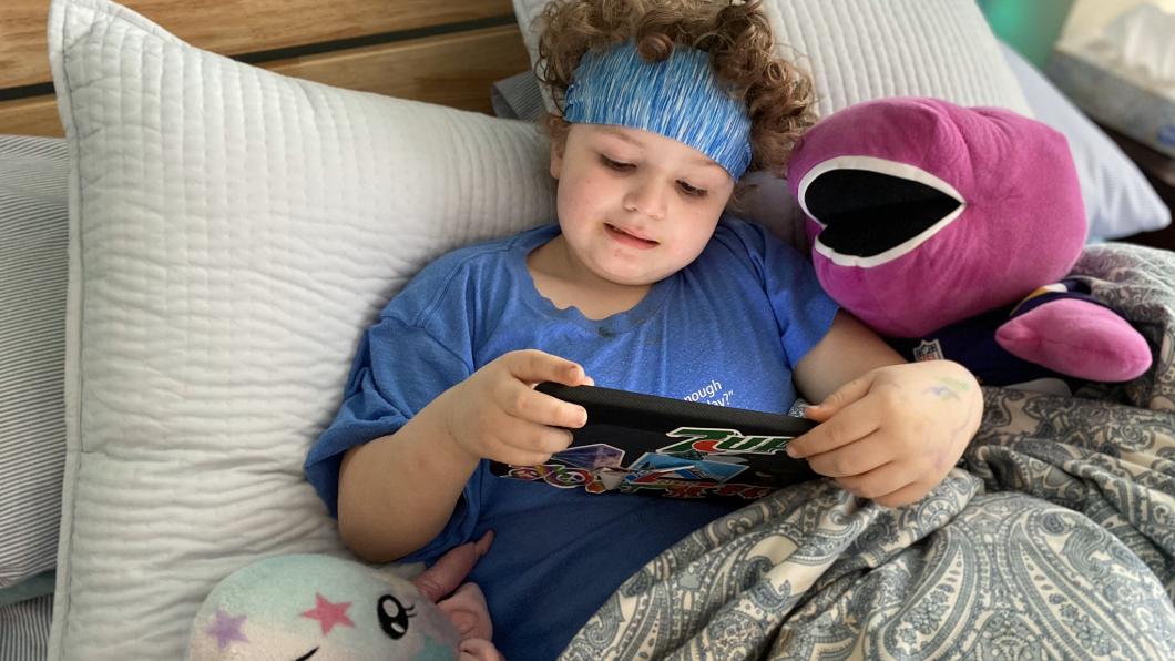 Phoenix playing on his iPad.