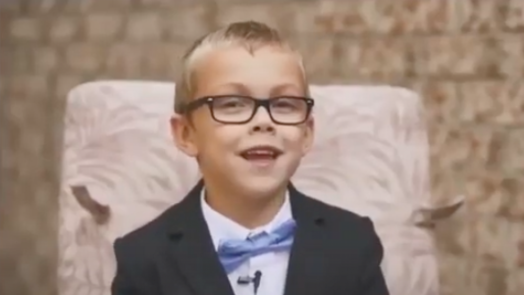 Alex smiling at the camera with his blue bowtie.