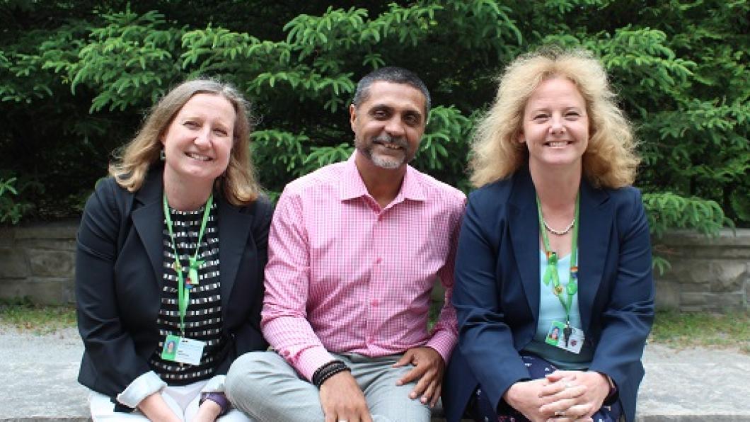 Jean Hammond (left) family and centred care specialist, sits with Amir Karmali (middle) and Kathryn Parker (right). This core team was integral to the development and delivery of the PFCC training program.